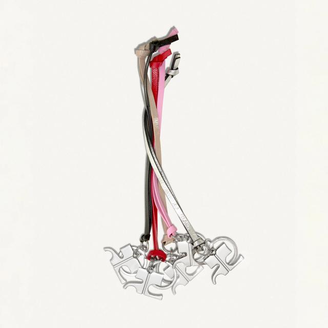 Elegant mixed-color leather belts with metallic details for Courrèges fashion accessories.