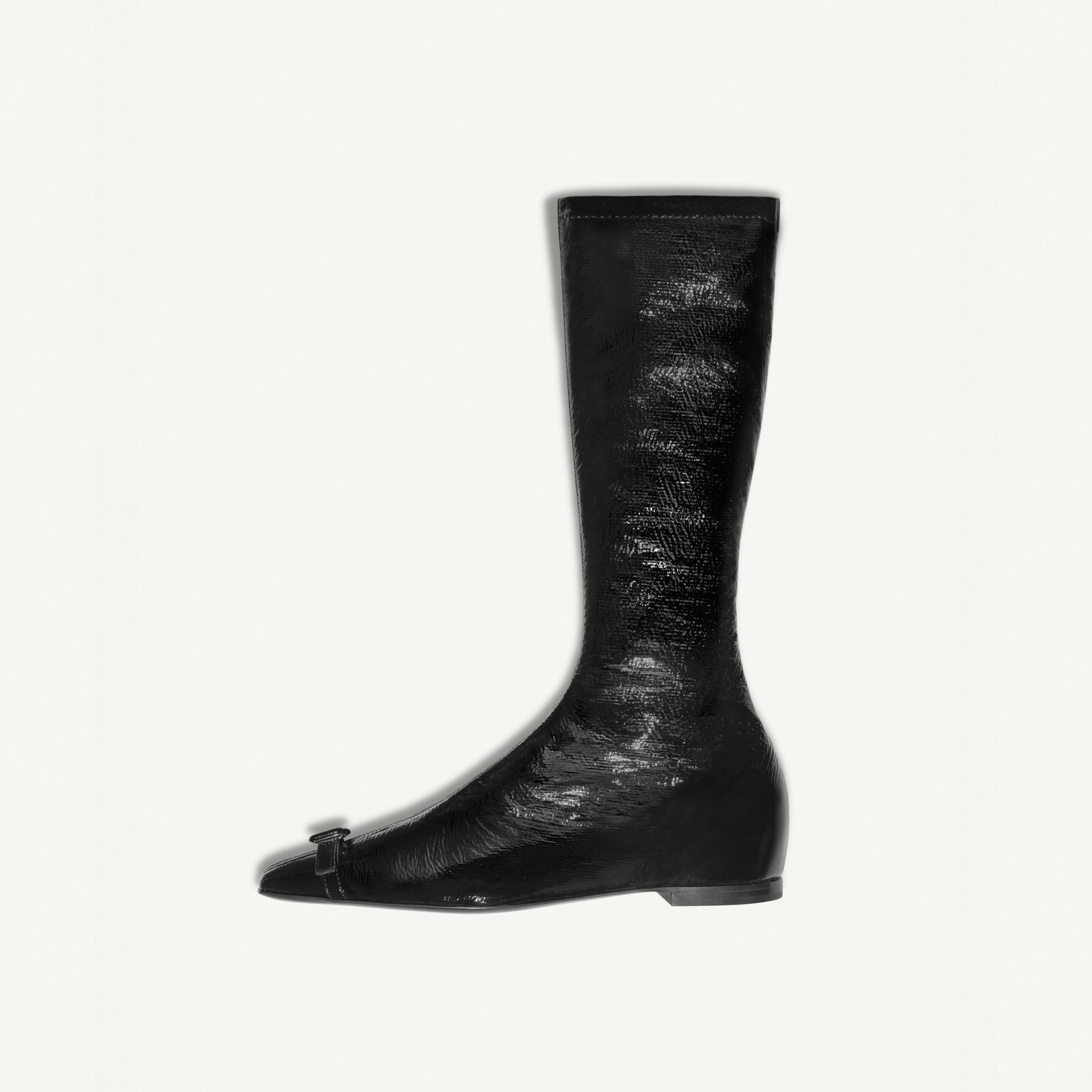 Elegant black leather knee-high boot featuring a pointed toe and sleek design for Courrèges.