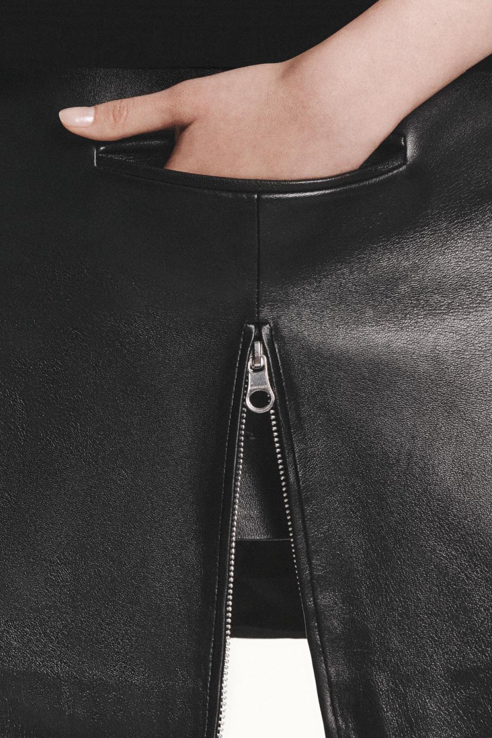 Elegant black leather fashion statement from Courrèges with a focus on a zipper detail.