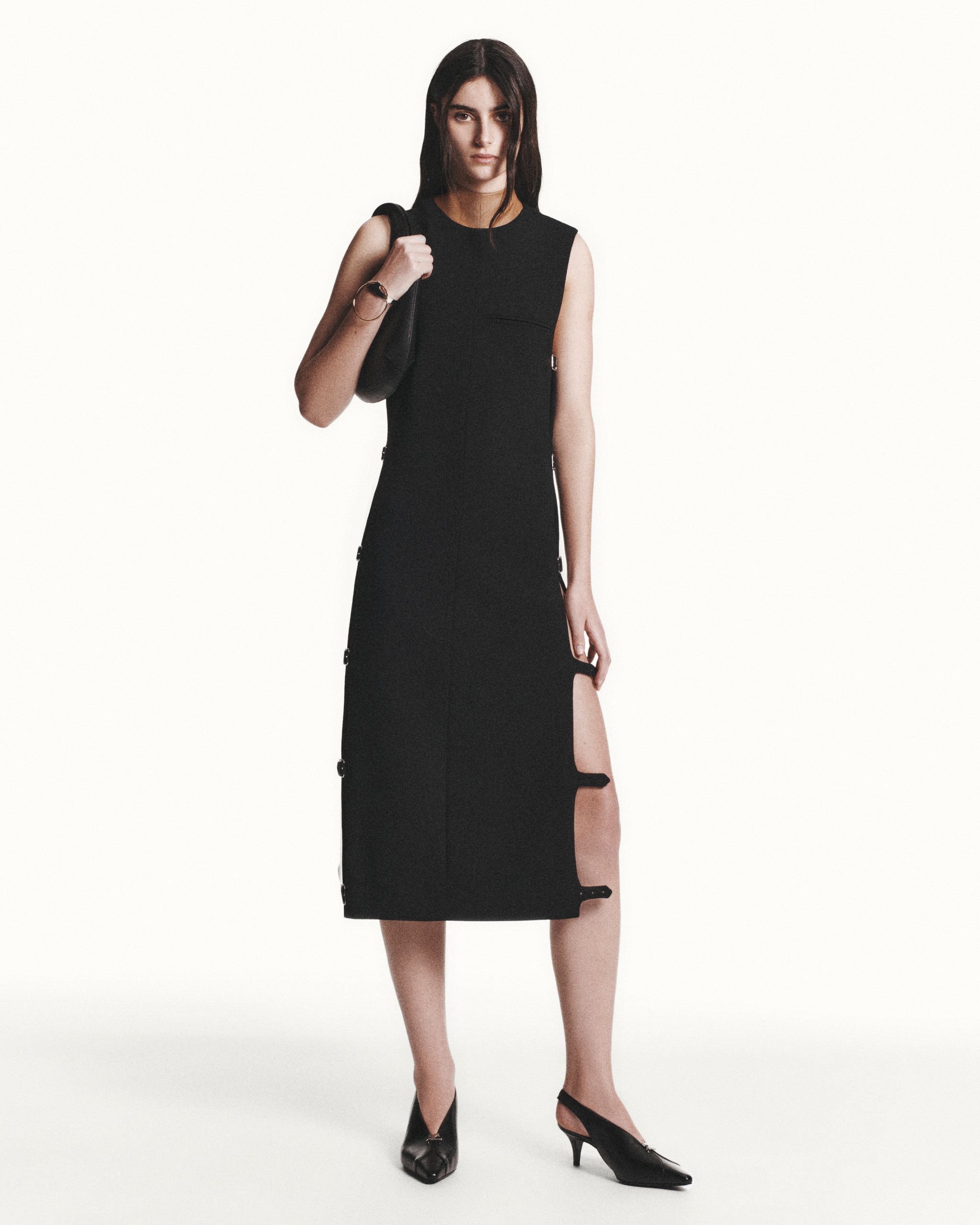 Elegant black midi dress with zipper details, perfect for modern fashion by Courrèges.