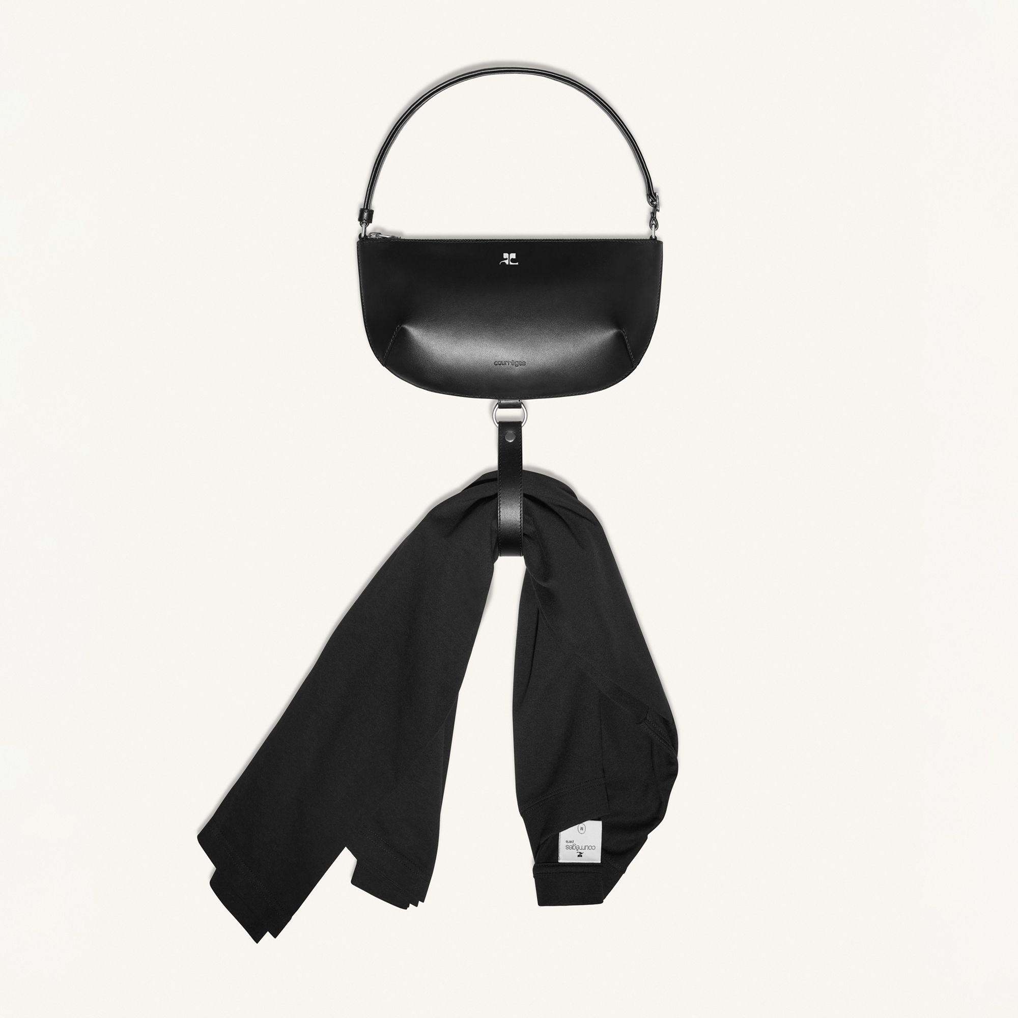 Elegant black Courrèges handbag with a stylish strap, showcased on a clean white background.