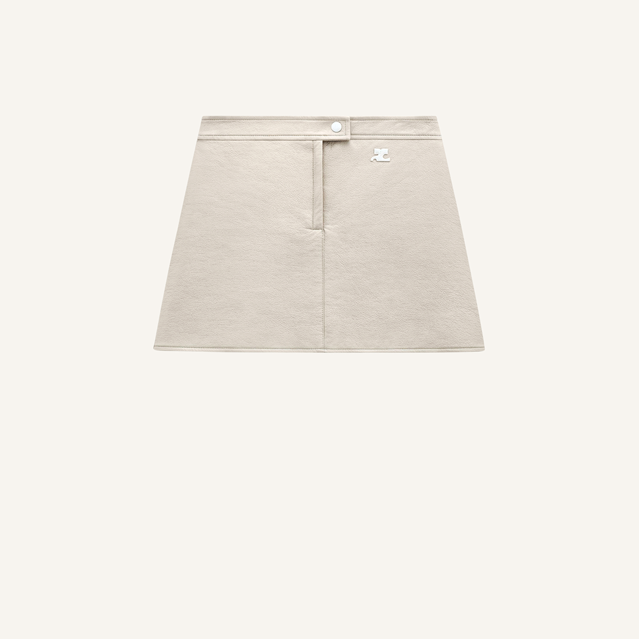 Elegant beige mini skirt from Courrèges, ideal for modern fashion statements on an ecommerce site.