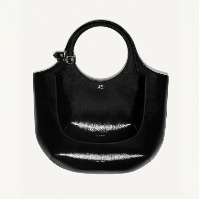 Elegant black Courrèges handbag with circular handle, stylish and perfect for fashion enthusiasts.