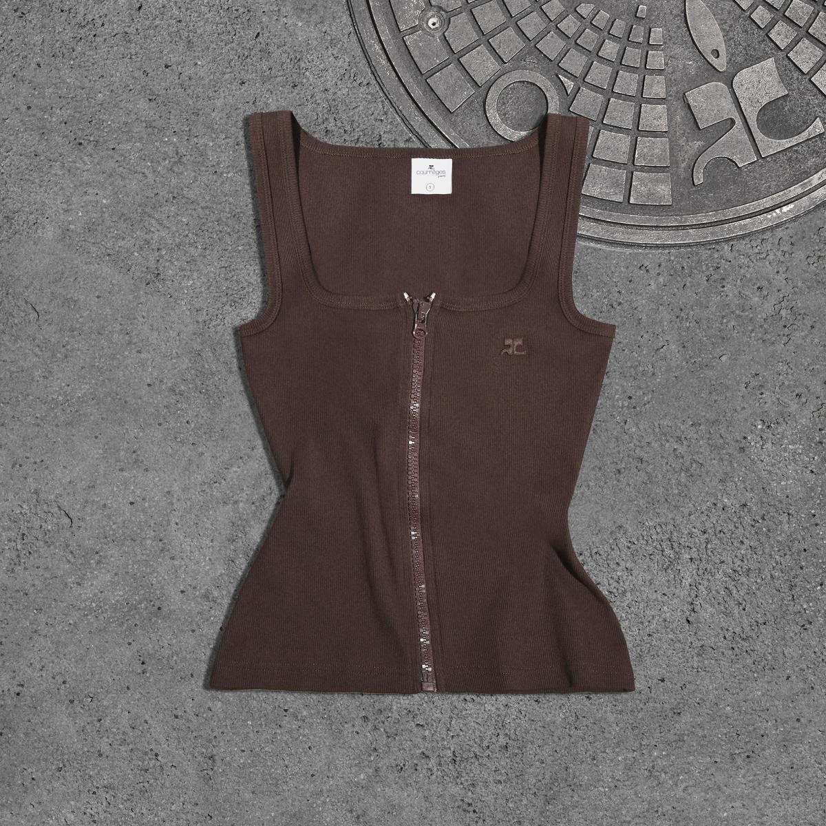 Elegant Courrèges brown sleeveless zip-up top displayed on concrete surface.