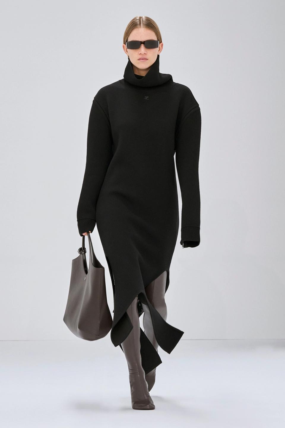 Elegant black turtleneck dress with asymmetric hem, perfect for Courrèges fashion collection.