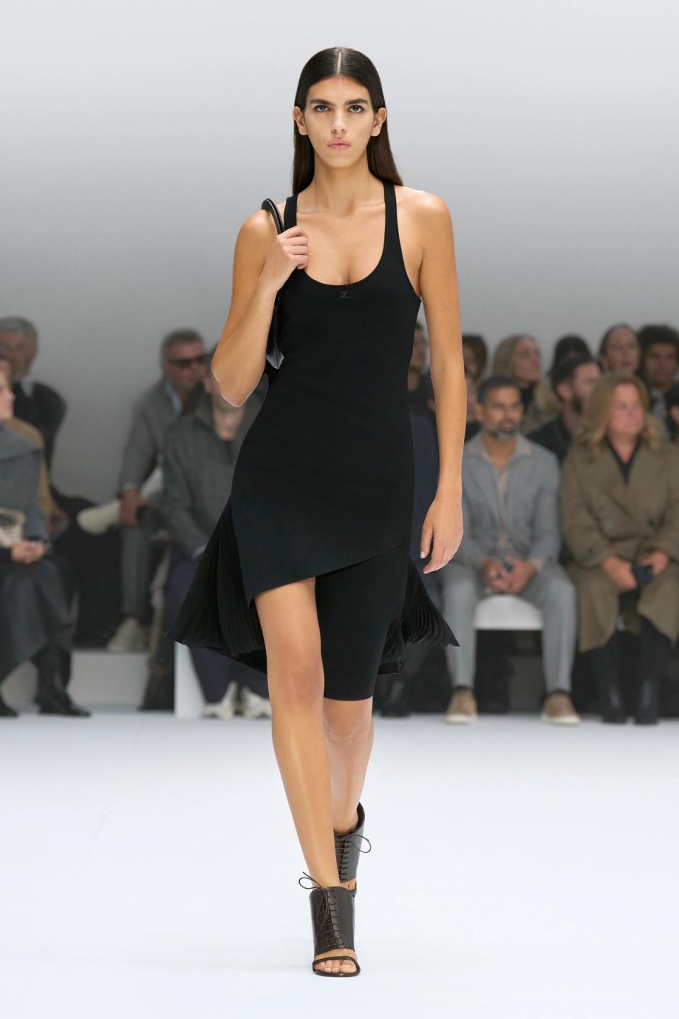 Elegant black dress by Courrèges runway fashion, perfect for a chic modern look.