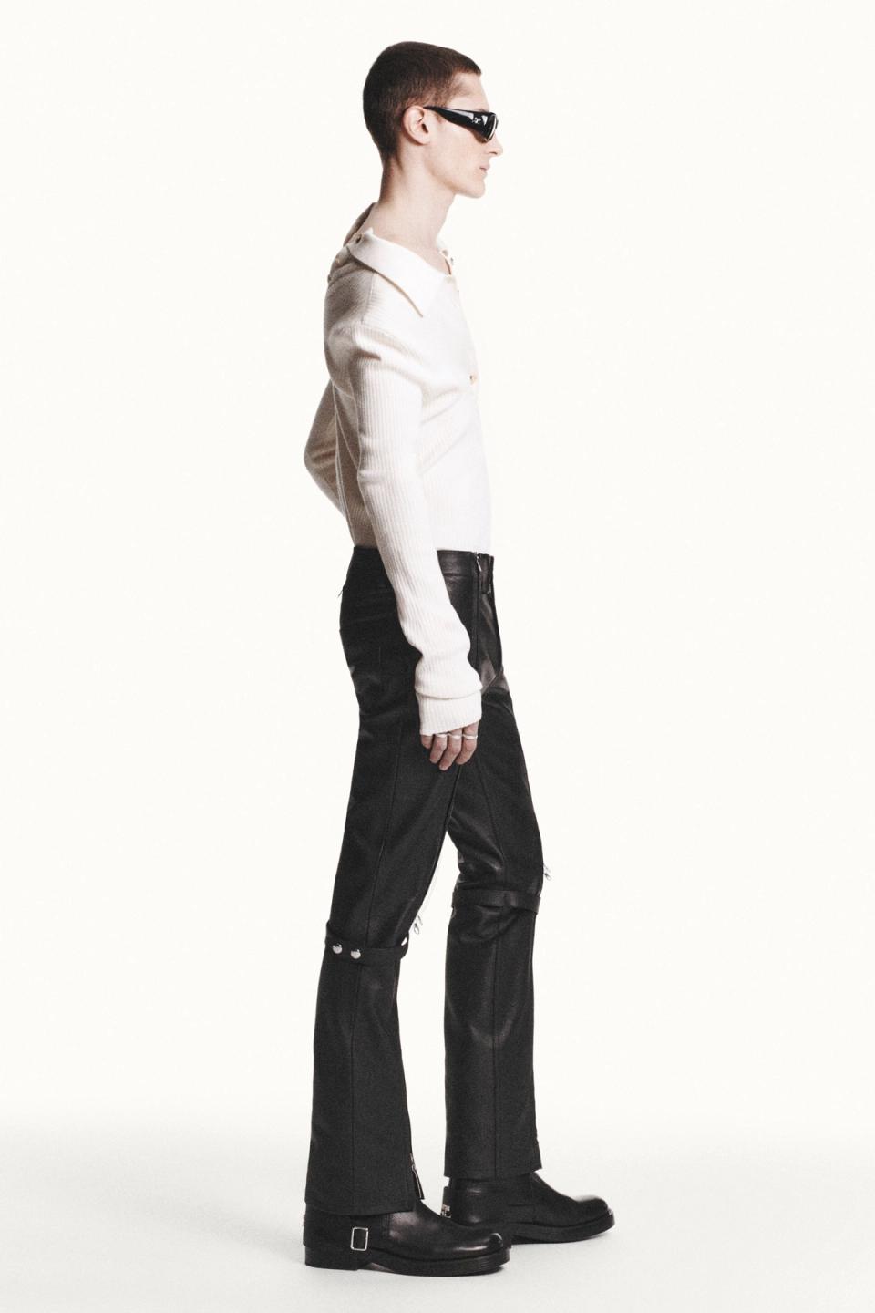 Elegant, modern fashion look with black leather pants and stylish sunglasses for Courrèges.