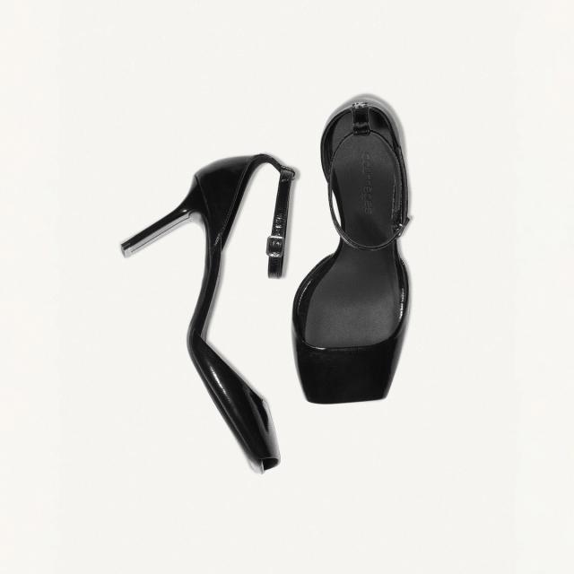 Elegant black high heel sandal with ankle strap, Courrèges fashion footwear for women.