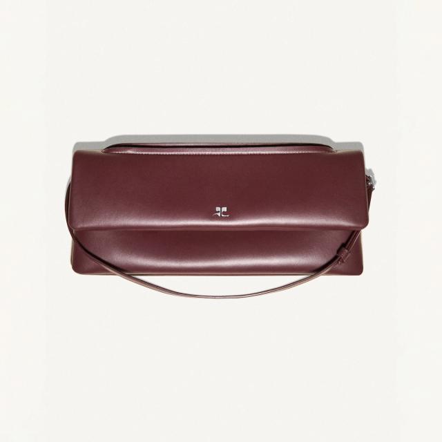 Elegant maroon Courrèges handbag with sleek design, perfect for fashion-forward accessories.