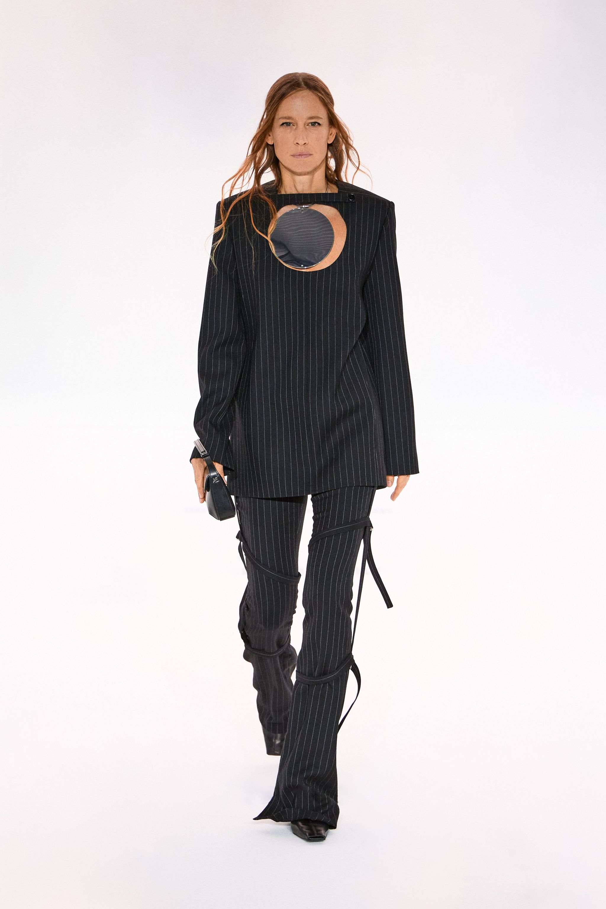 Elegant black pinstripe suit by Courrèges for a modern fashion statement on an ecommerce site.