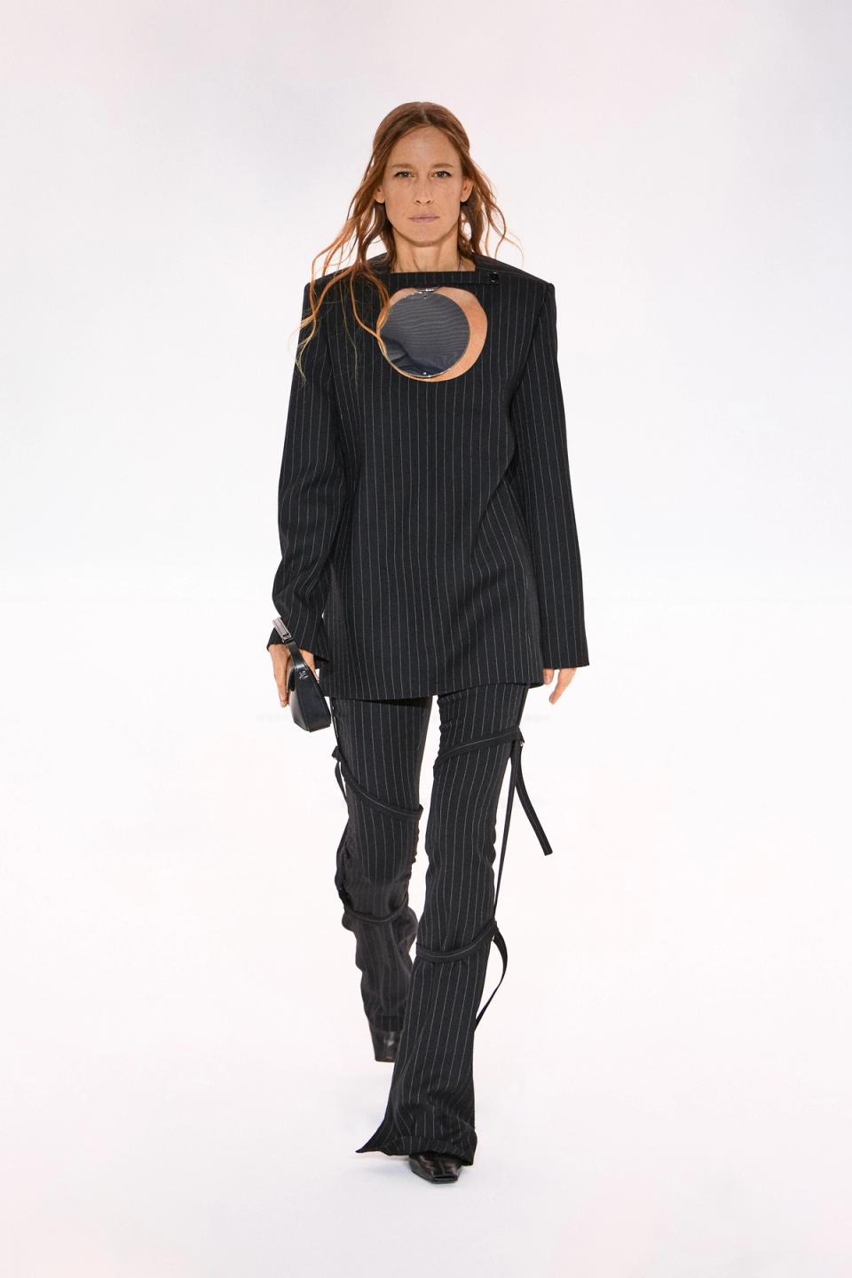 Elegant black pinstripe suit by Courrèges for a modern fashion statement on an ecommerce site.