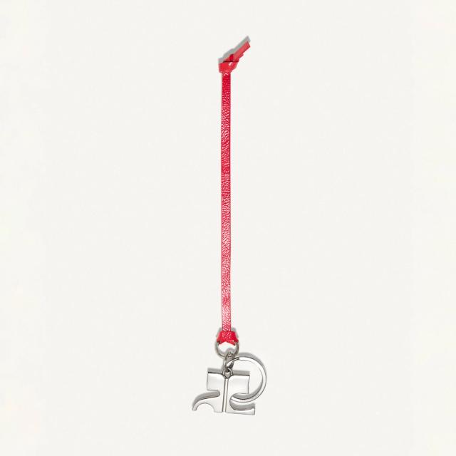 Elegant red and silver Courrèges keychain with numerical charm for a chic fashion accessory.