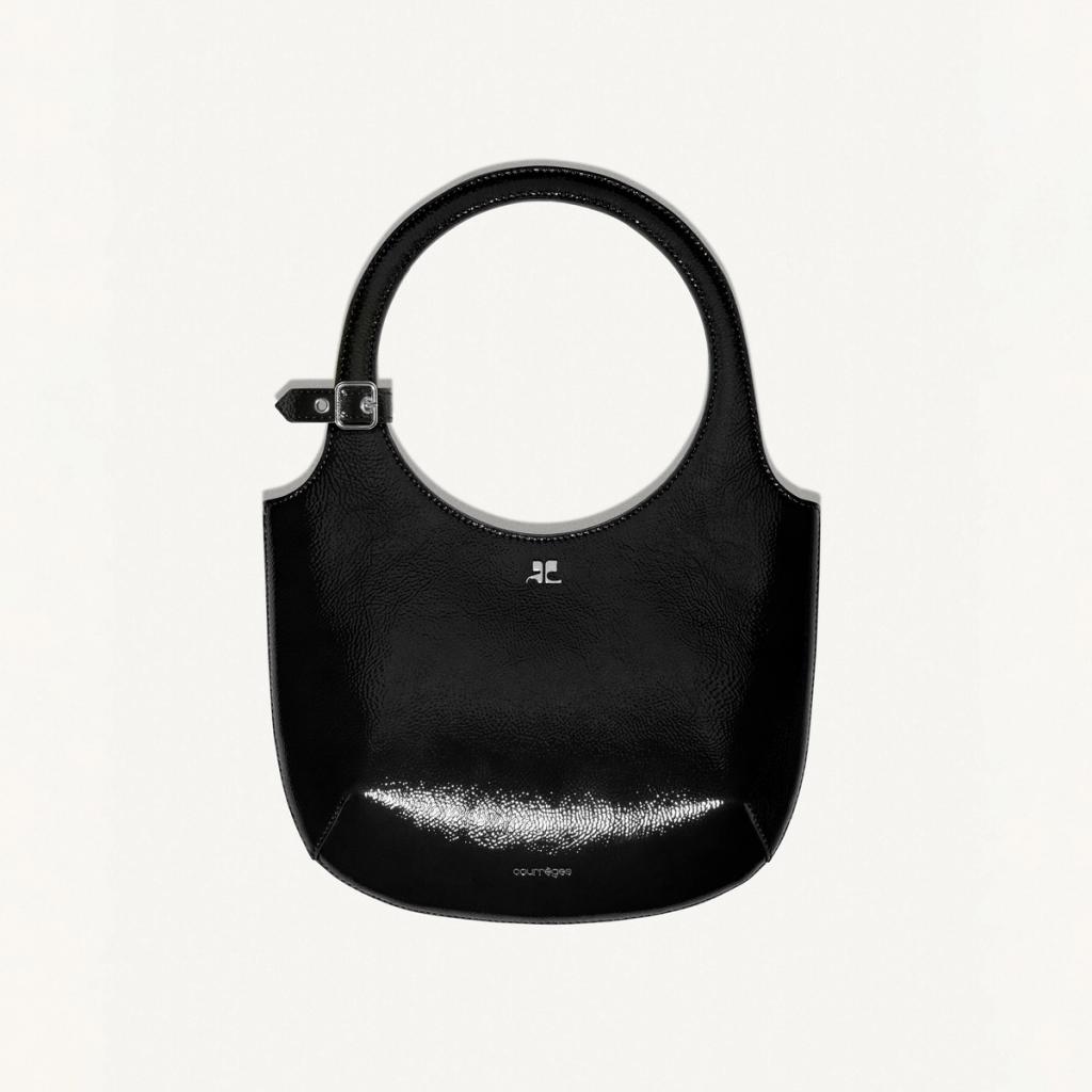 Elegant black leather handbag by Courrèges, perfect for chic fashion accessories.