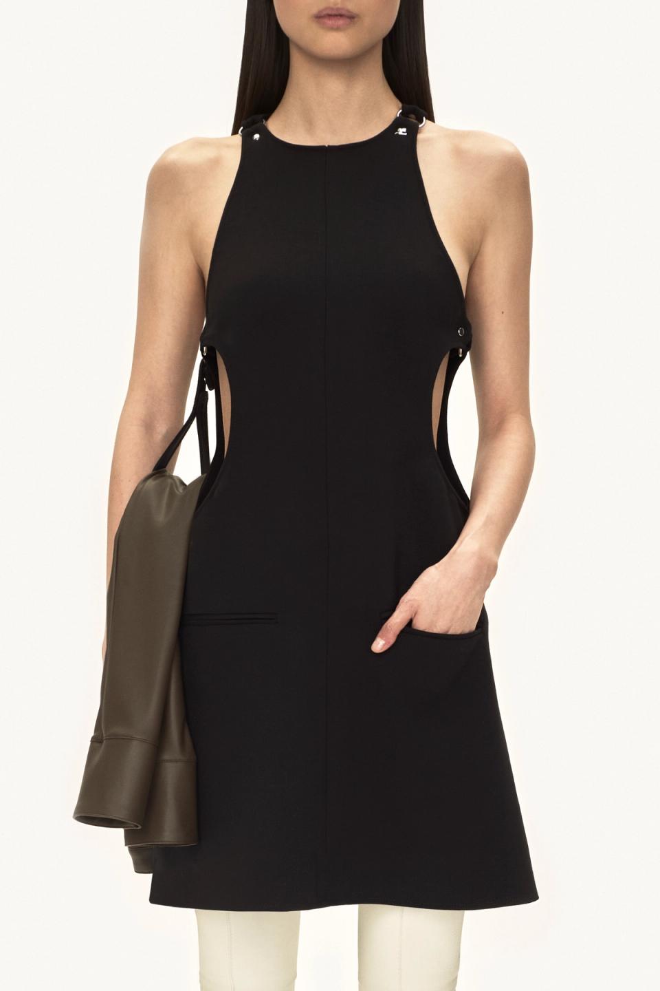 Elegant black dress with cut-outs, sleek design, and the Courrèges logo for a modern fashion statement.