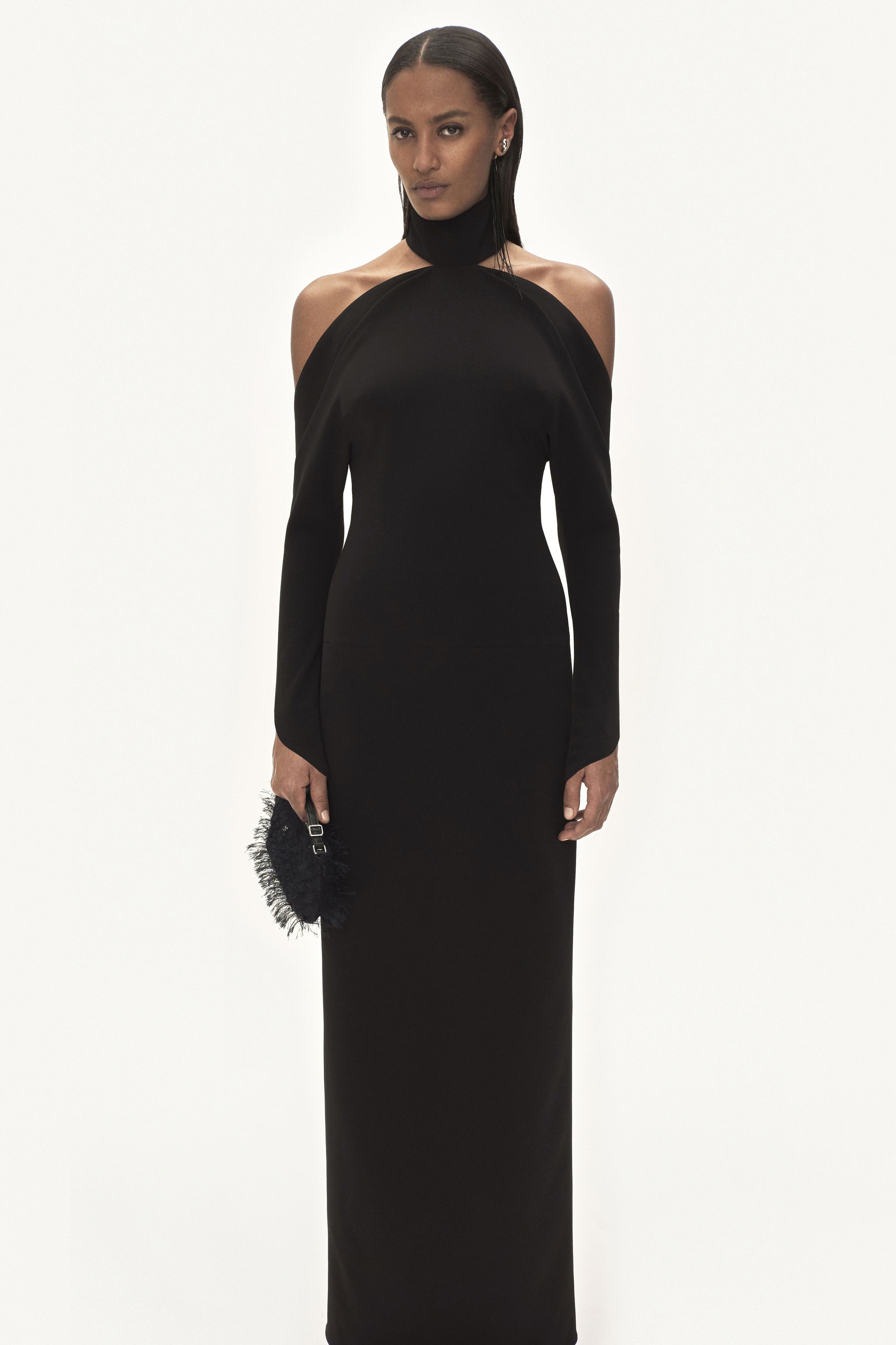 Elegant black off-shoulder gown with unique cutout design, by Courrèges for fashion lovers.
