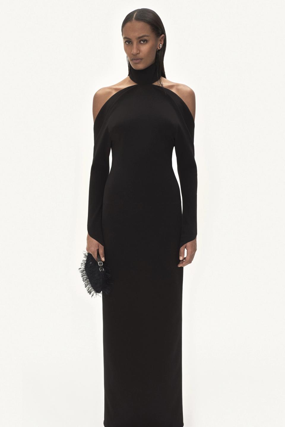 Elegant black off-shoulder gown with unique cutout design, by Courrèges for fashion lovers.