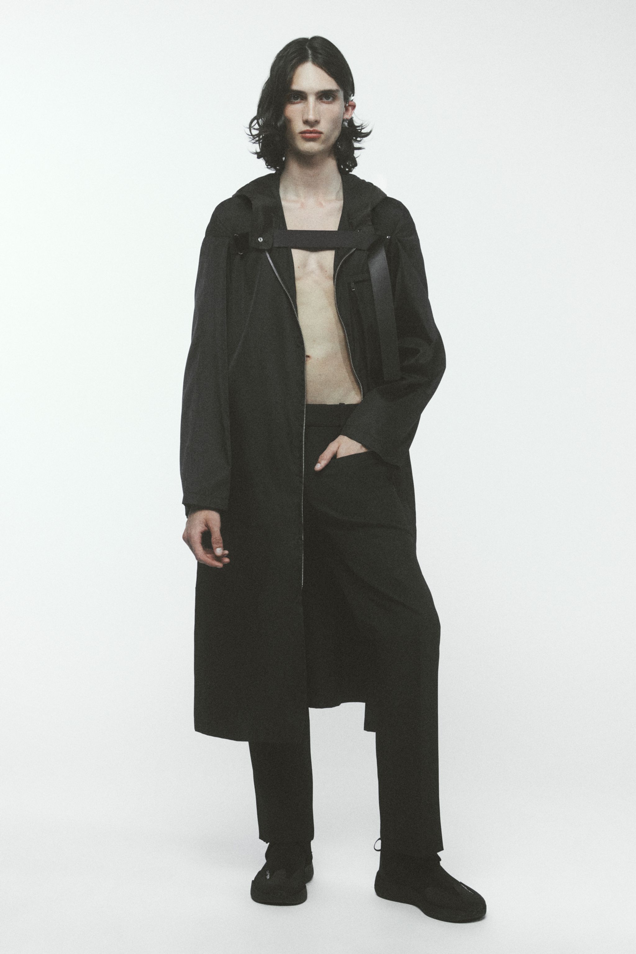 Elegant black Courrèges jacket and wide pants for a modern, chic look in fashion ecommerce