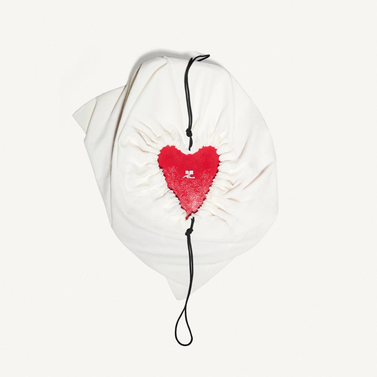 Elegant white bag with a red heart design from Courrèges, perfect for fashion lovers.