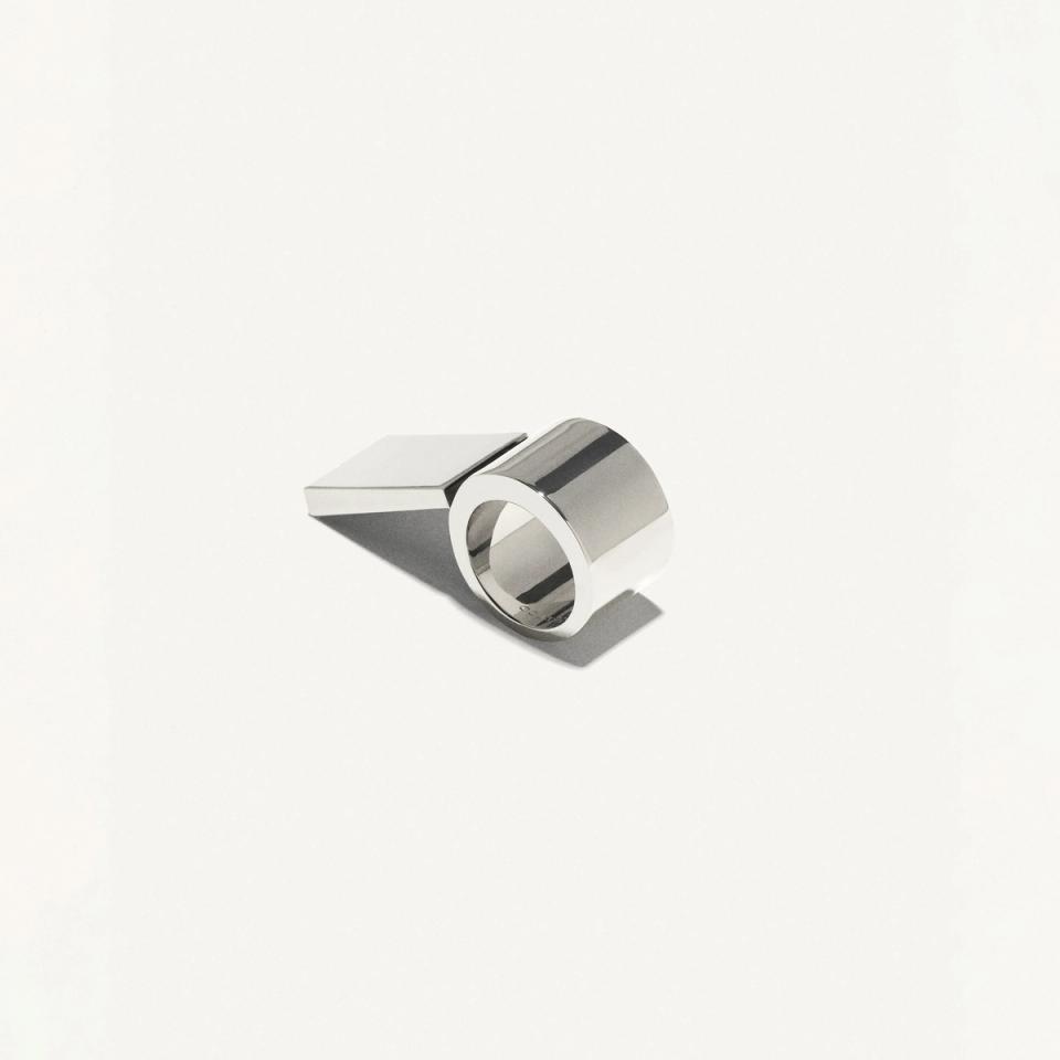 Elegant, silver metallic ring with geometric design, fashionable accessories from Courrèges.