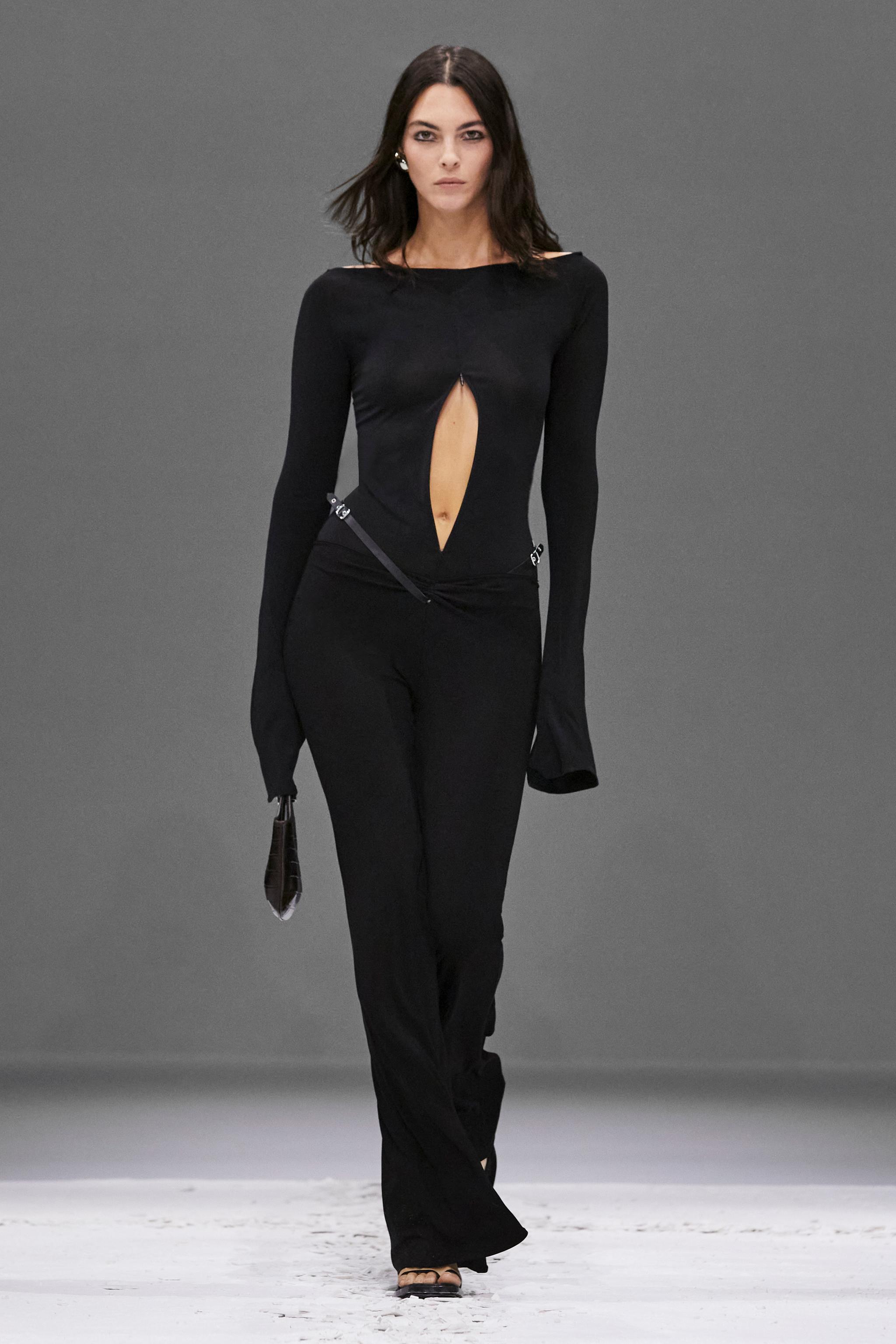 Elegant black Courrèges dress with a daring cutout, suitable for high-fashion ecommerce displays.