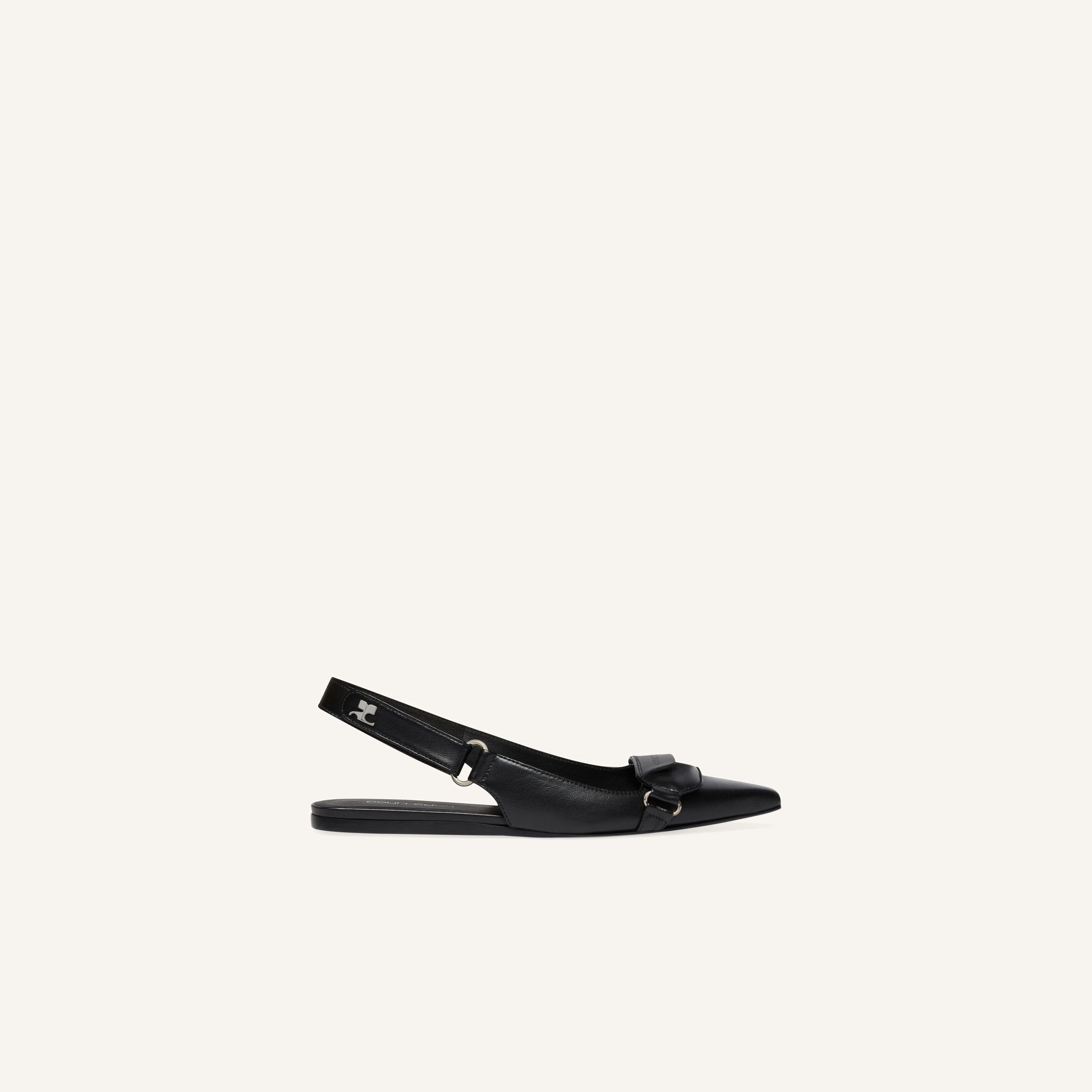 Elegant black leather slingback shoes with bow detail, designed by Courrèges for a chic look.