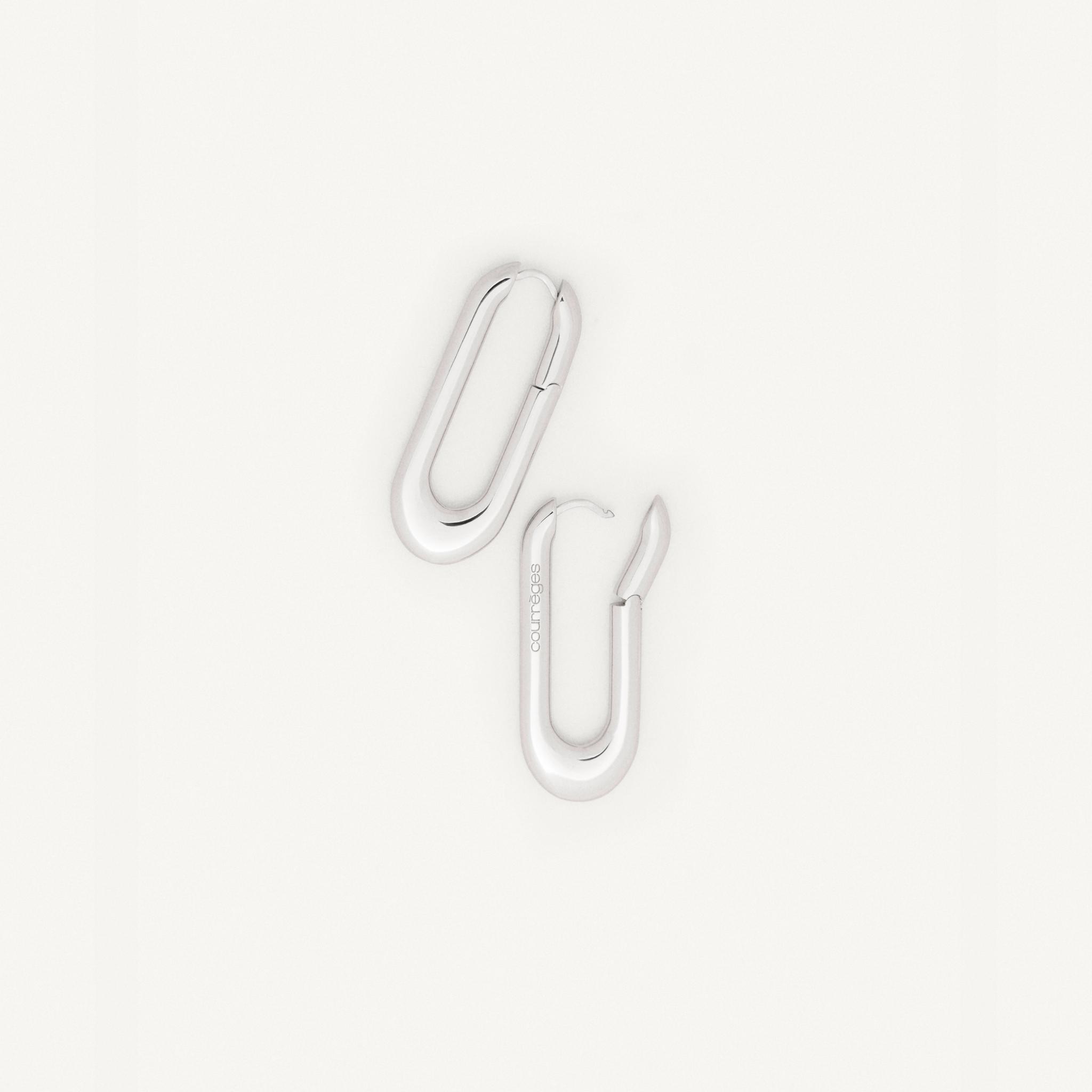 Elegant white neon paperclip earrings by Courrèges, on a clean white background.