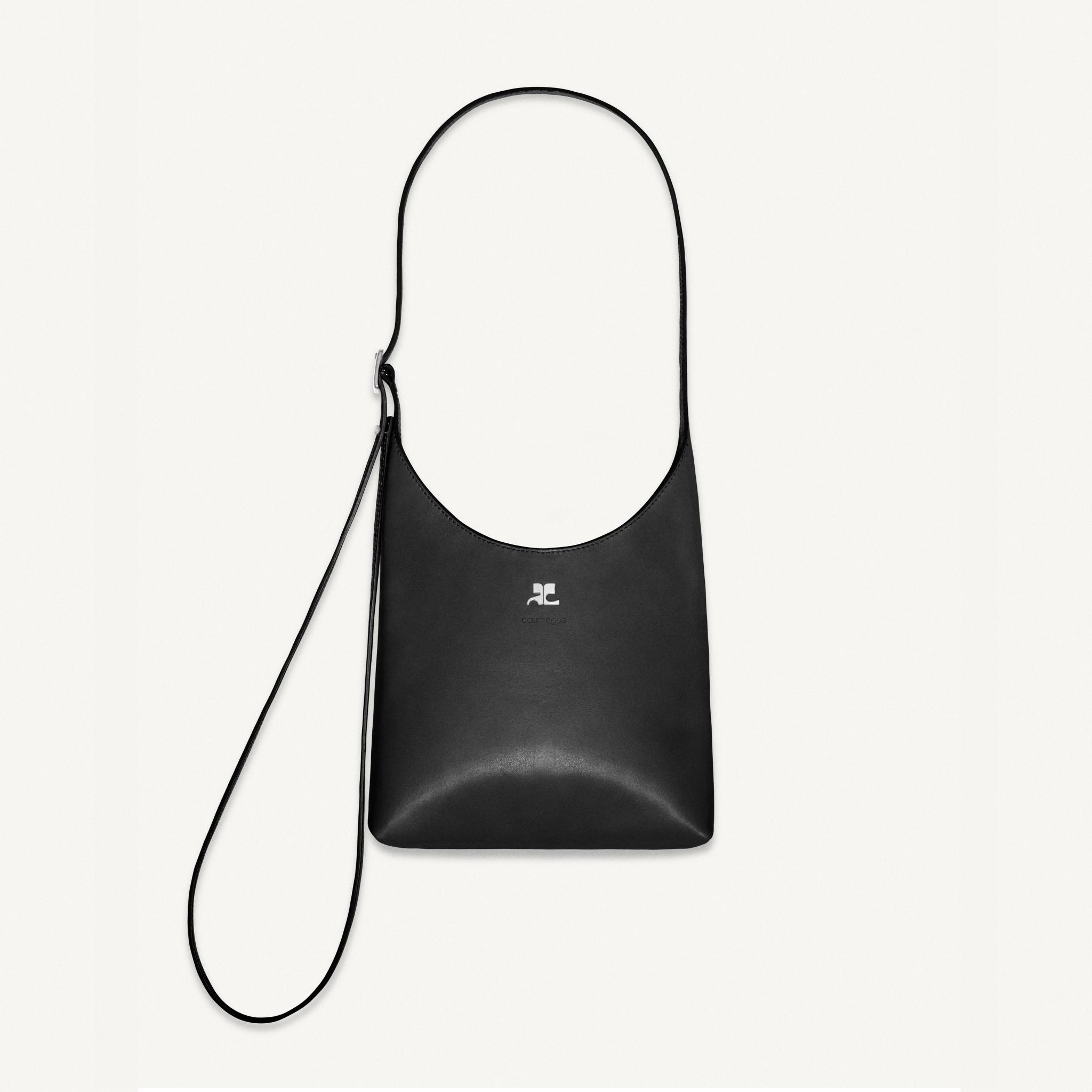 Elegant black leather handbag by Courrèges, sophisticated accessory for fashion-forward looks.