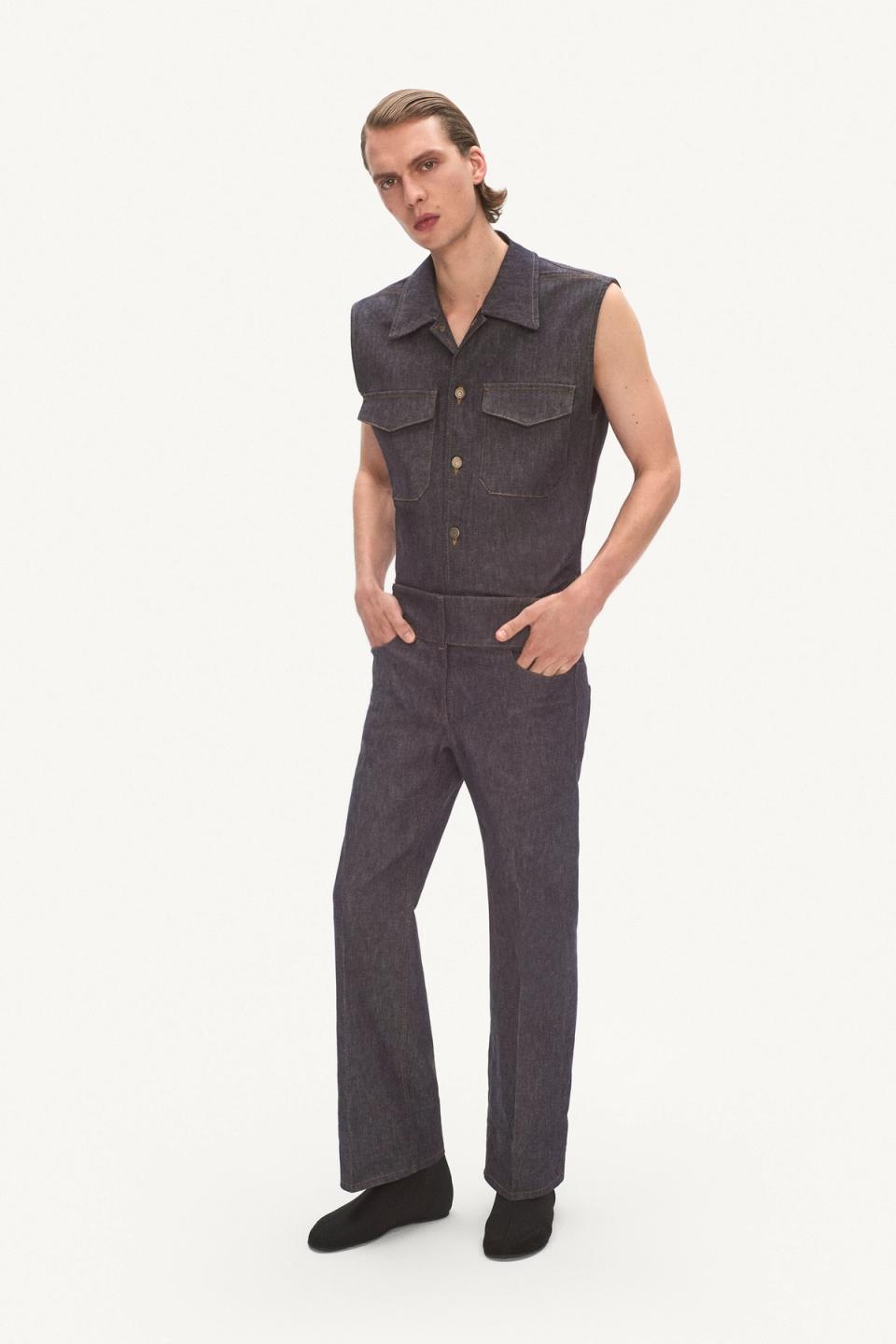 Elegant denim sleeveless jumpsuit by Courrèges, perfect for modern fashion statements.