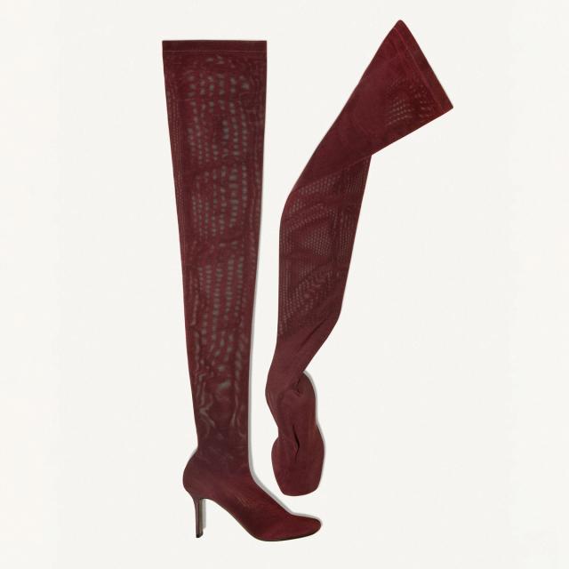 Elegant burgundy thigh-high boots by Courrèges, perfect for modern chic style on an ecommerce site.