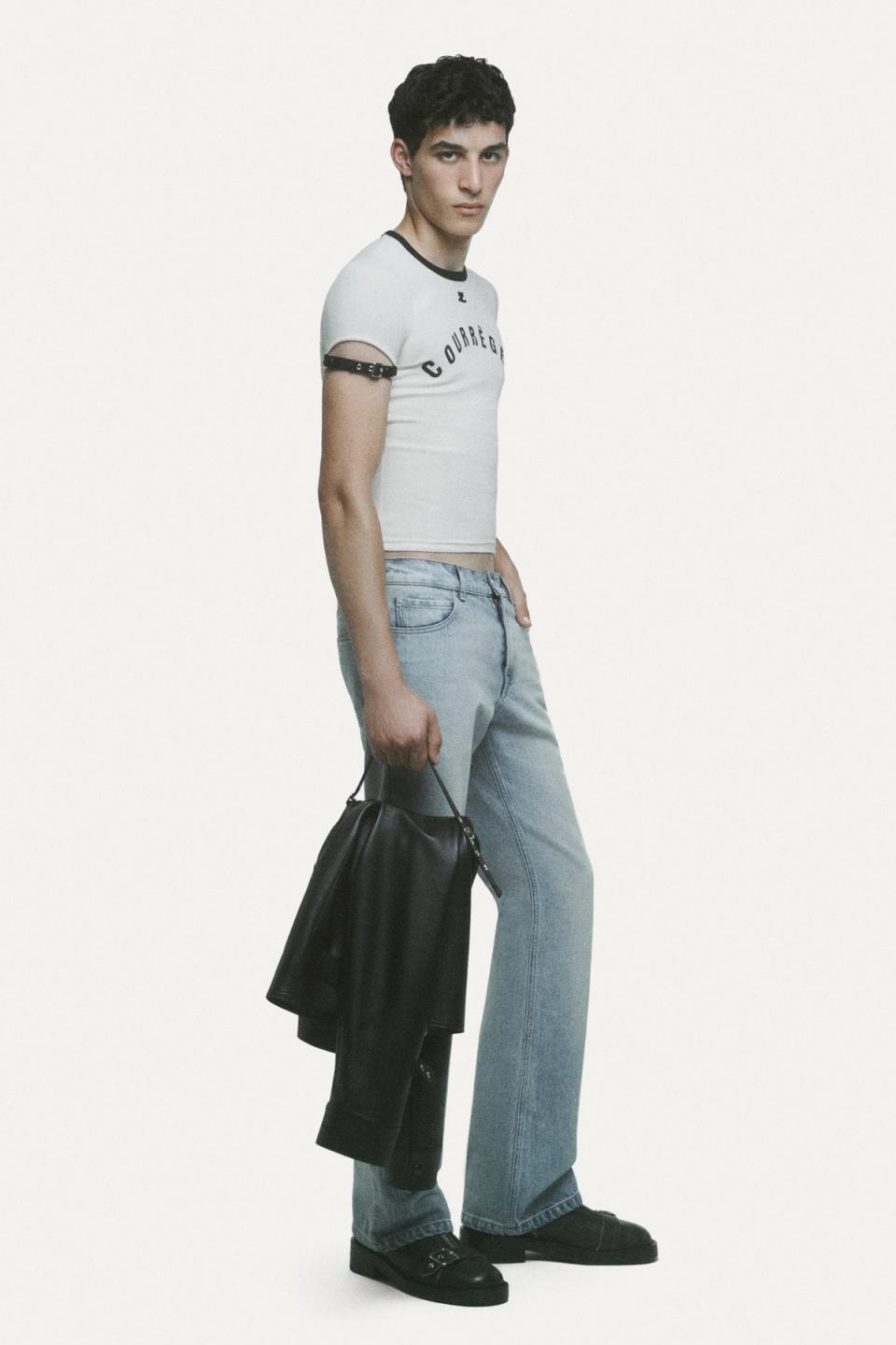 Elegant casual outfit featuring Courrèges branded crop top, jeans, and accessories for fashion lovers.