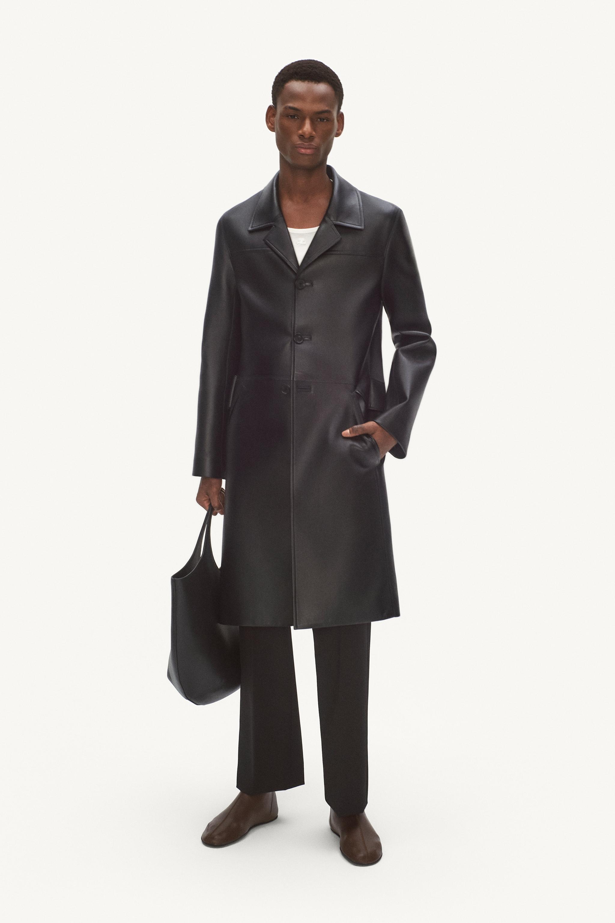 Elegant black leather coat by Courrèges, perfect for high fashion and modern style.