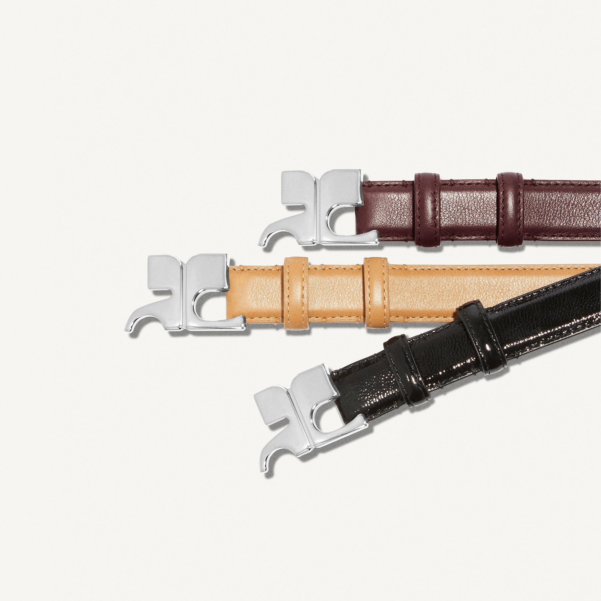 Elegant designer belts with metallic buckles, available on Courrèges ecommerce site.