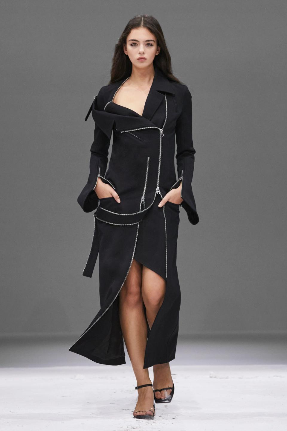 Elegant black avant-garde jacket and skirt ensemble from Courrèges for modern fashion lovers.