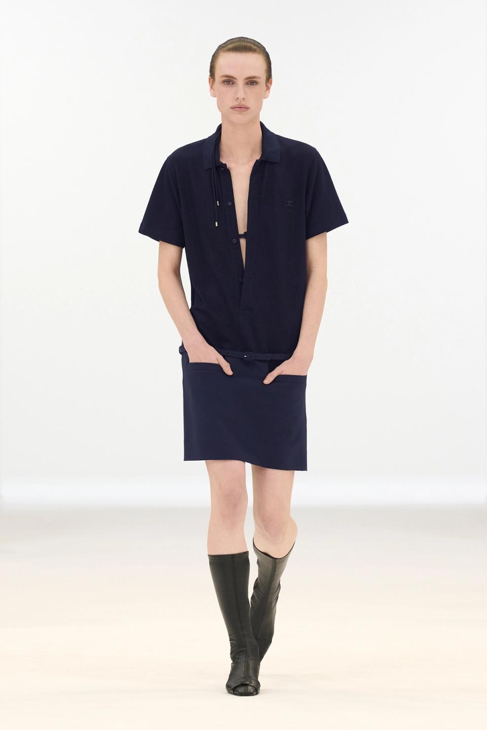 Elegant navy dress and shirt with modern style, showcased by Courrèges on model for shopping.