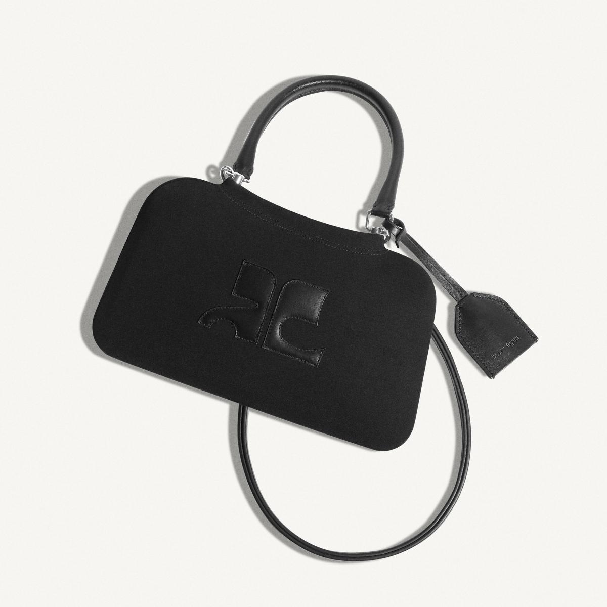 Elegant black Courrèges handbag with logo embossed design, perfect for stylish fashion accessories.