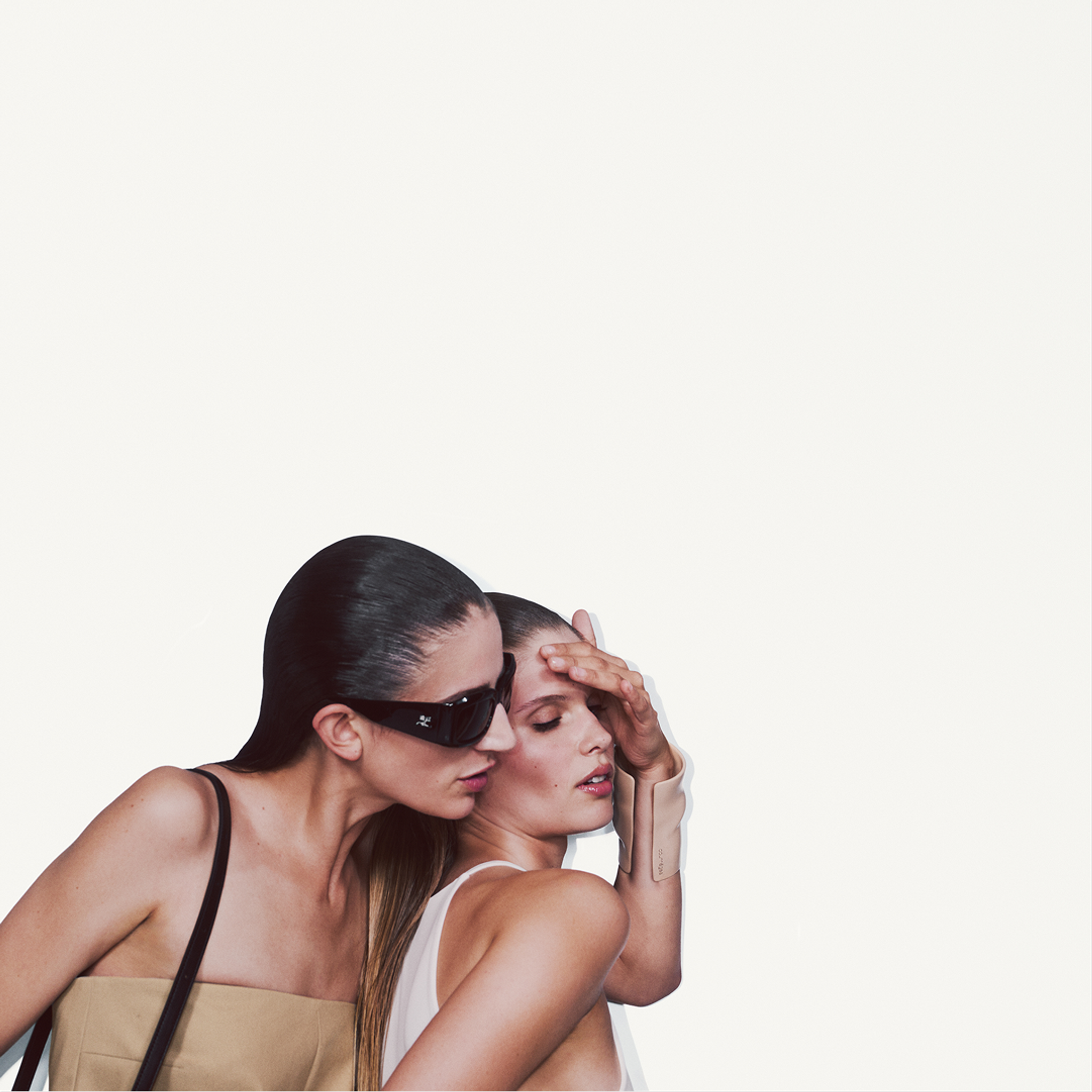 Elegant fashion models showcasing Courrèges accessories and contemporary style.