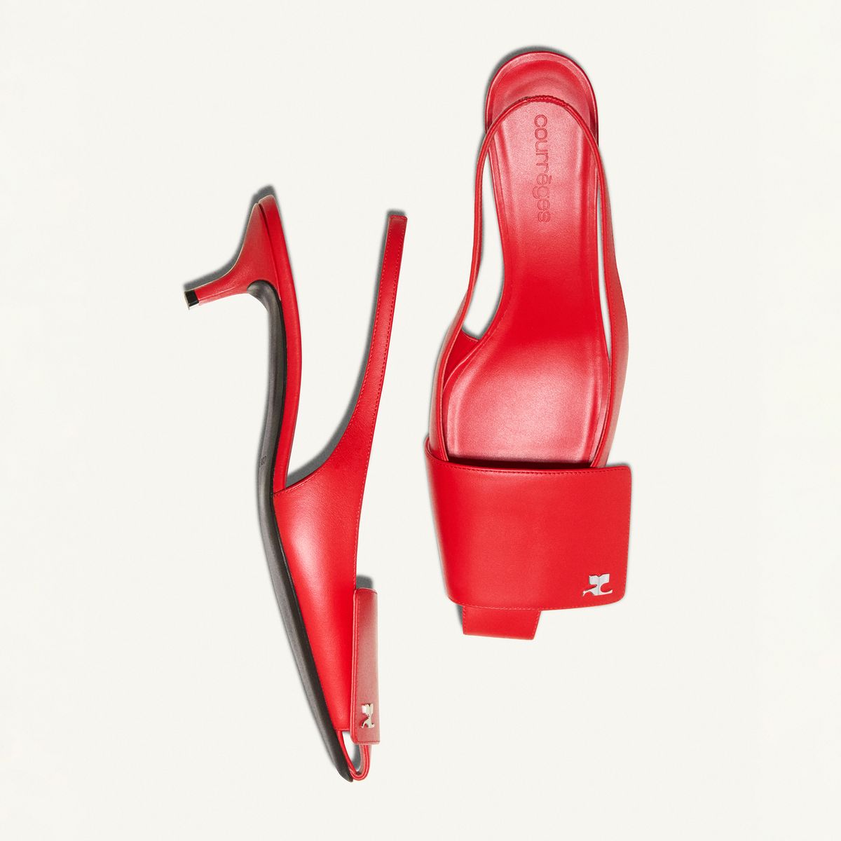 Elegant red Courrèges high-heeled shoes showcased on a white background, perfect for fashion lovers.