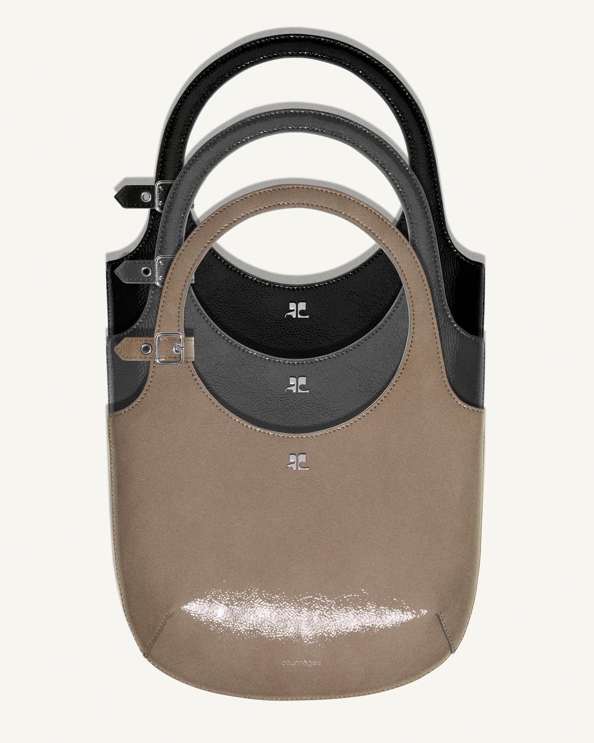 Elegant Courrèges handbags in black and beige, showcasing modern minimalist design for fashion.