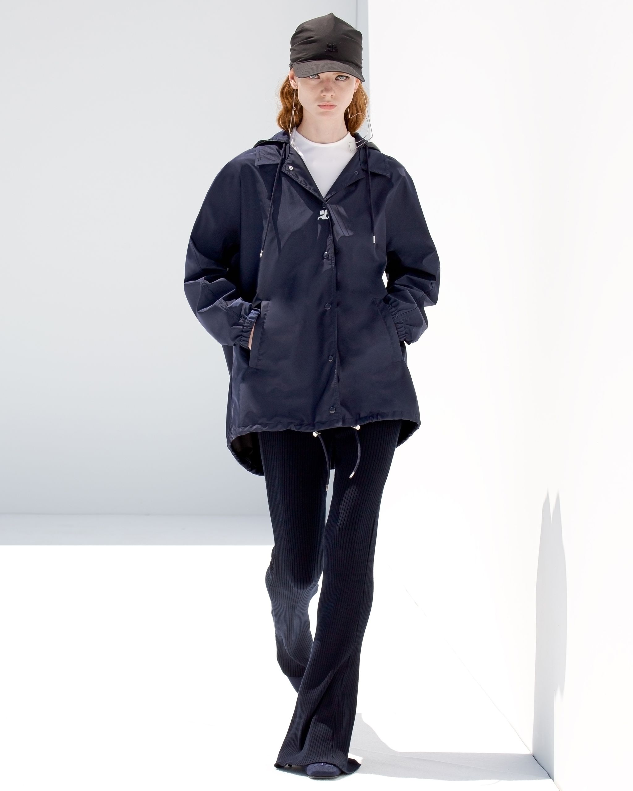 Elegant navy lightweight jacket with drawstrings, for Courrèges fashion on an ecommerce site.
