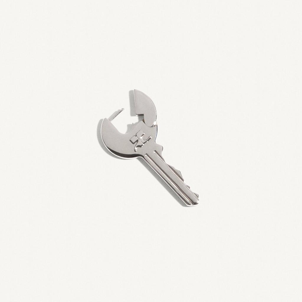 Elegant silver key-shaped jewelry piece, from Courrèges, perfect for fashion accessories.