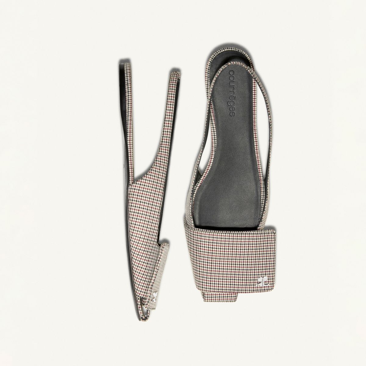 Elegant Courrèges black and white checkered strappy sandal, sophisticated for fashion fans.