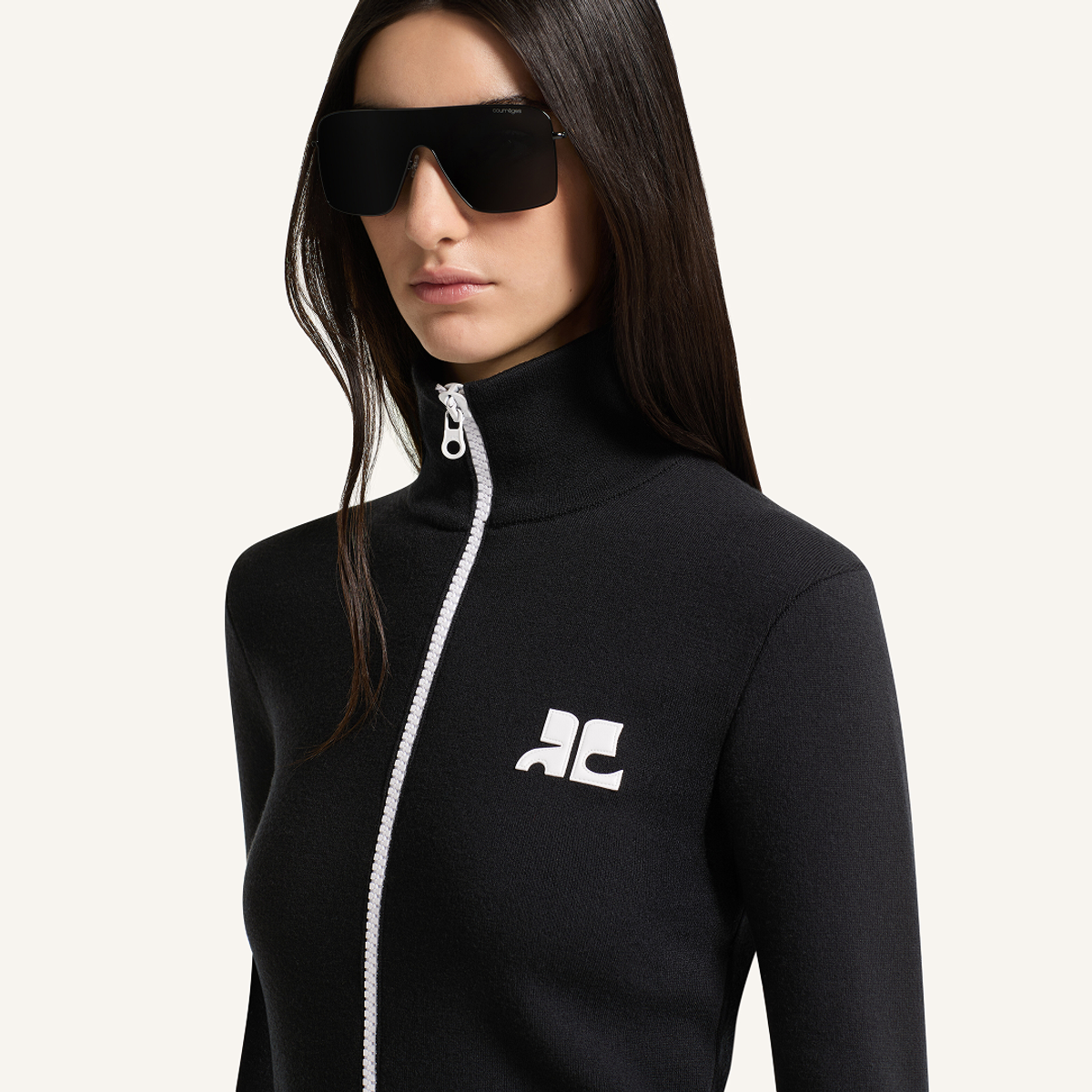 Elegant black zip-up sweatshirt with Courrèges logo, perfect for a chic, modern look.