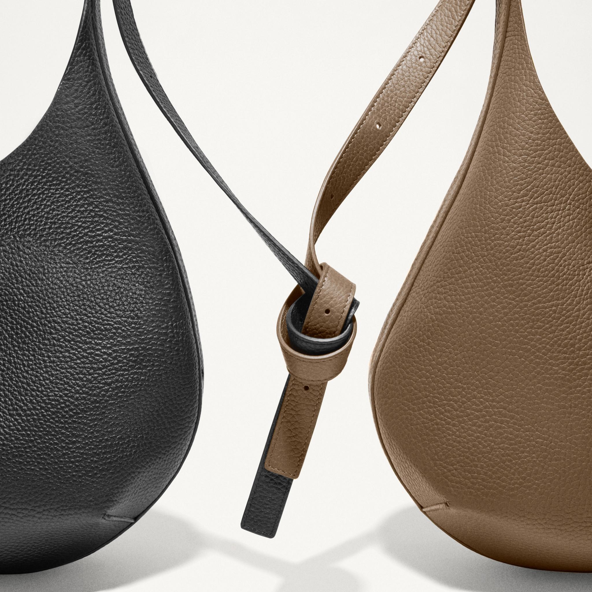 Elegant leather handbags by Courrèges showcased on an ecommerce website for fashion.