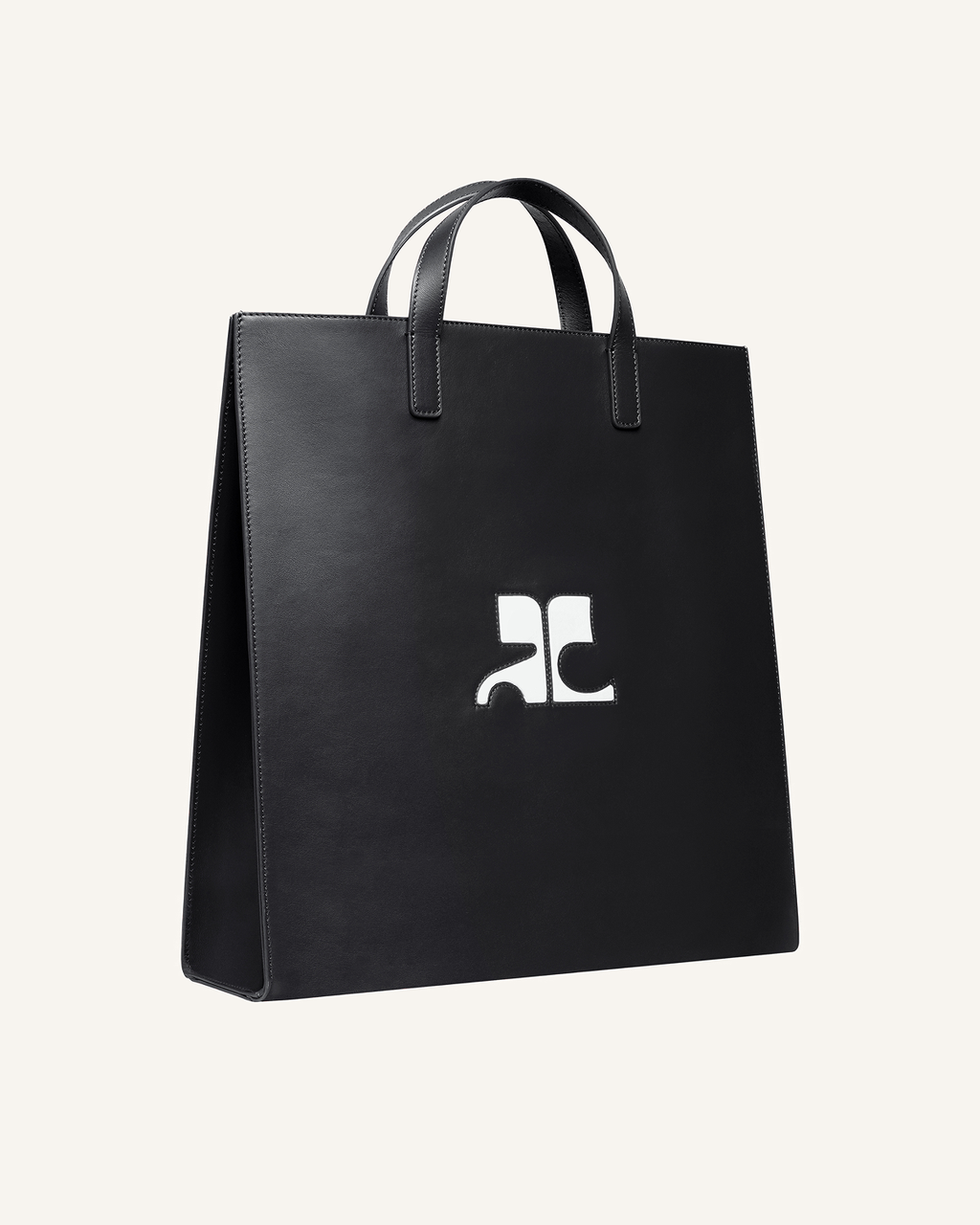 Elegant black leather tote bag with Courrèges logo, perfect for chic shopping or everyday style.