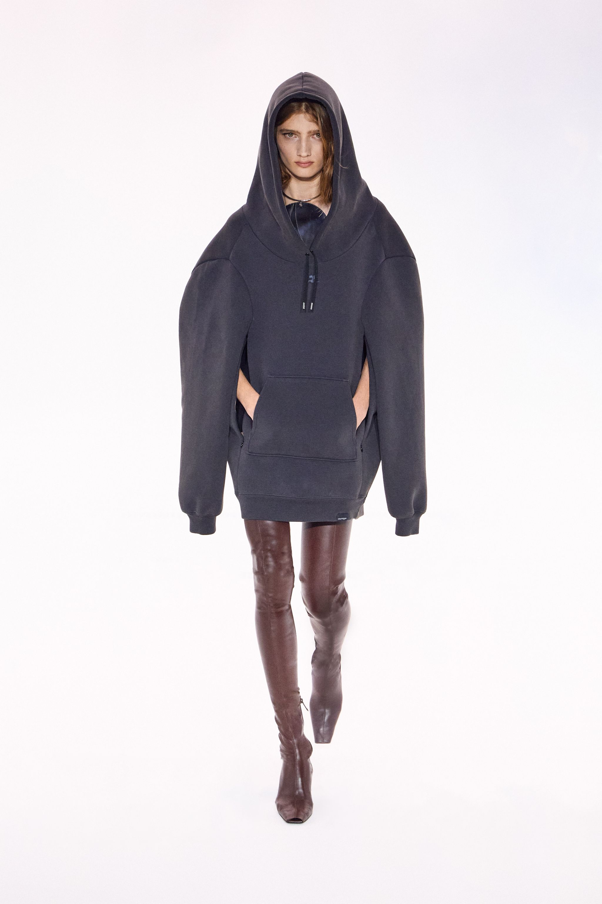 Elegant black hoodie with oversized sleeves, perfect for Courrèges fashion style.