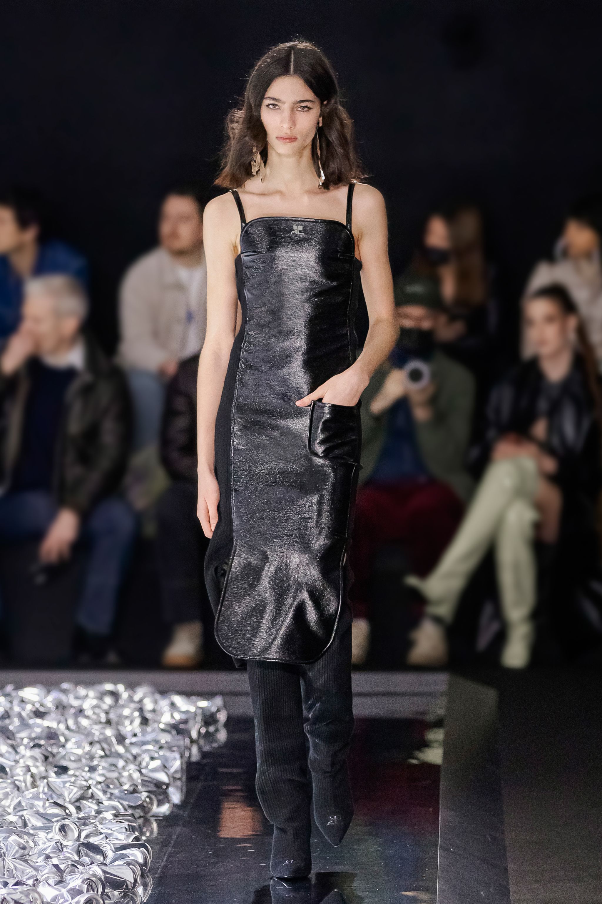 Elegant black Courrèges dress with shiny finish and delicate straps for chic fashion style.