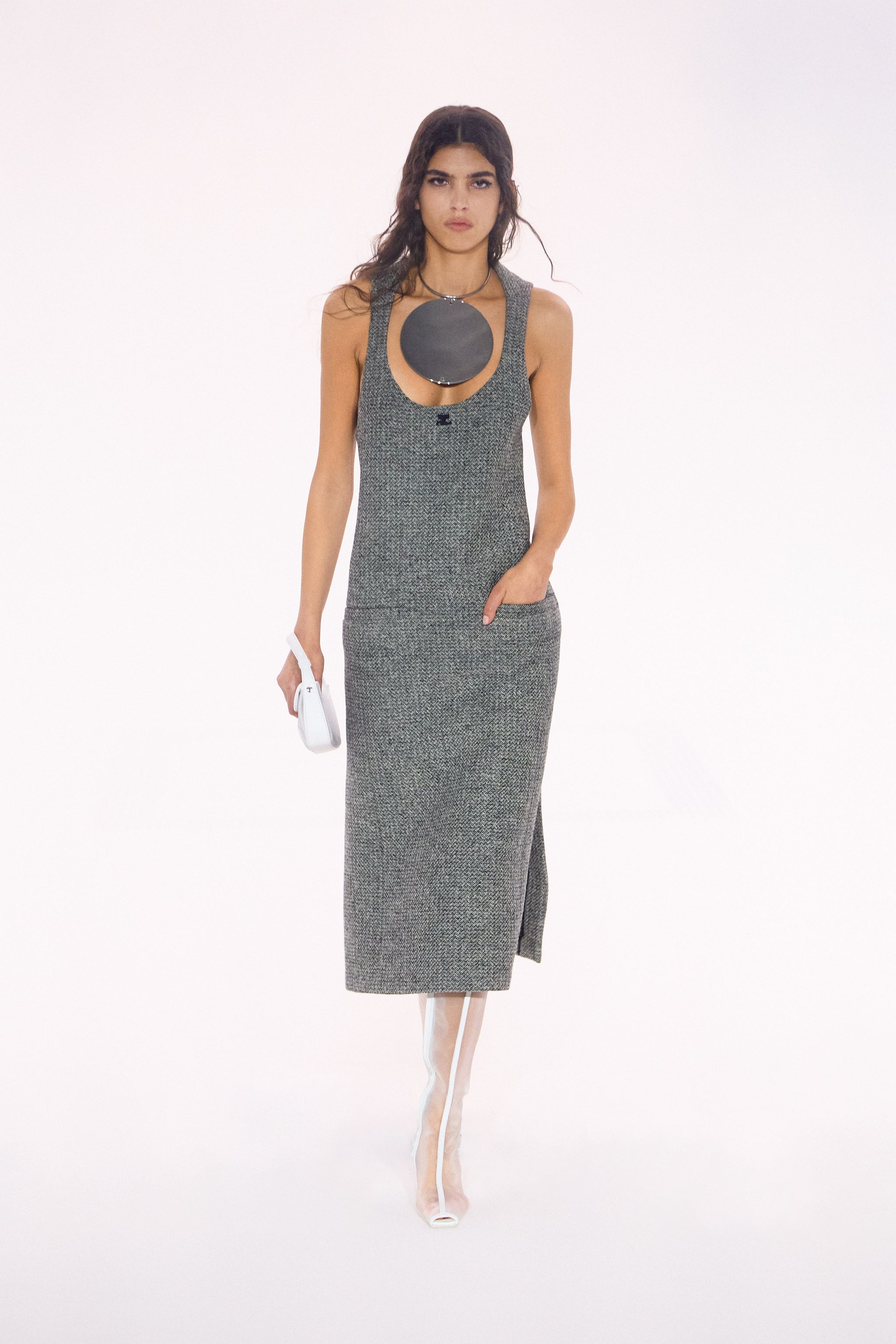 Elegant gray knit dress by Courrèges displayed on a model for an e-commerce website.