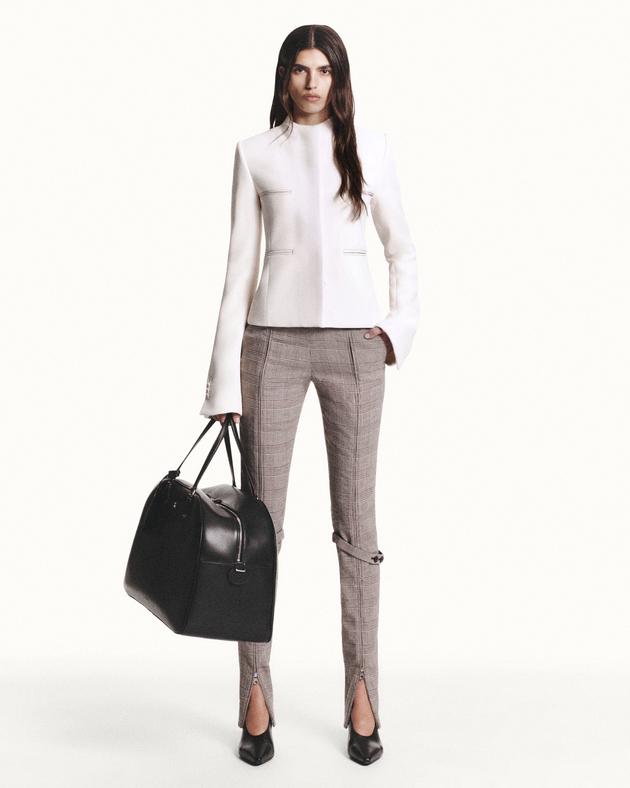Elegant white blazer with plaid pants and black accessories, Courrèges fashion for women.
