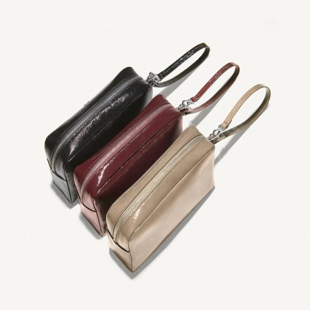 Elegant beige, red, and black patent leather handbags with detachable straps for Courrèges.