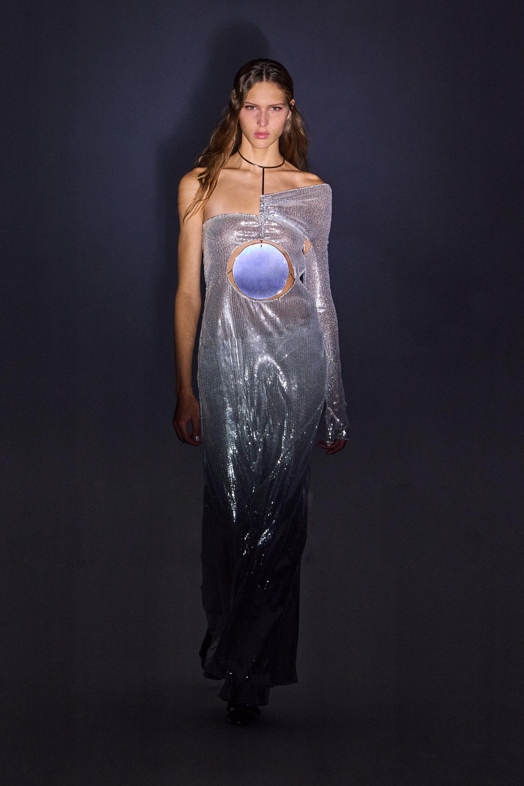 Elegant metallic futuristic dress by Courrèges, perfect for modern fashion statements.